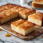 Irresistible Dream Cake Recipe: How to Make 1 Drømmekage at Home 5 Freshly baked dream cake with golden coconut topping
